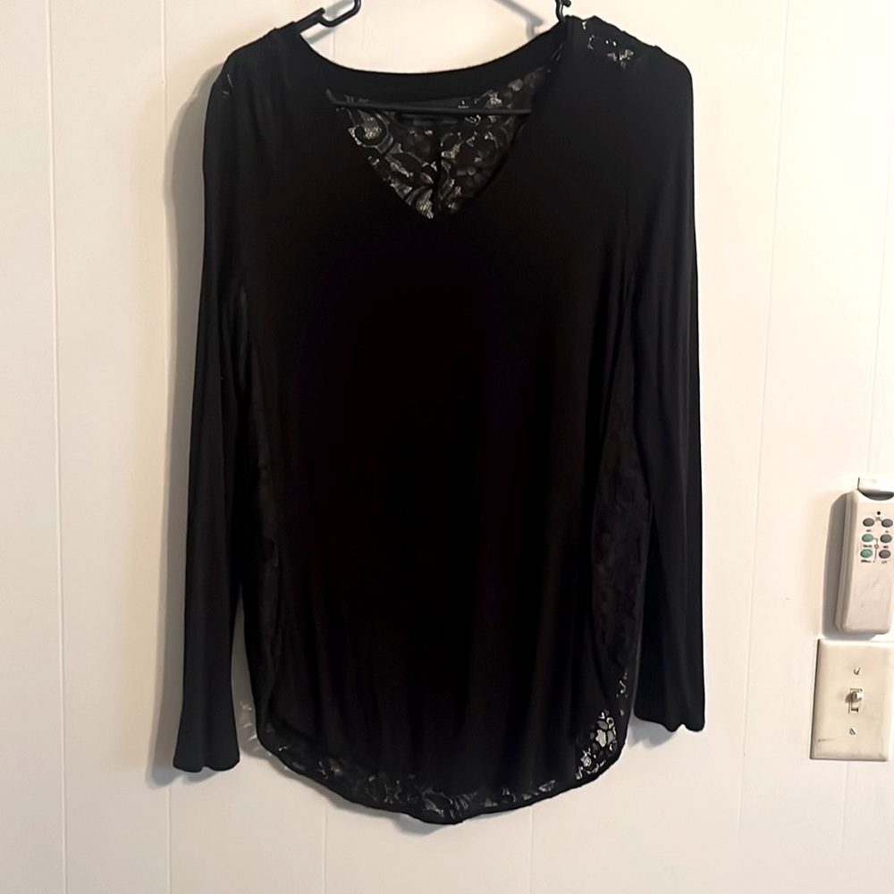 Black loose fitting long sleeve APT9 shirt with full lace back.